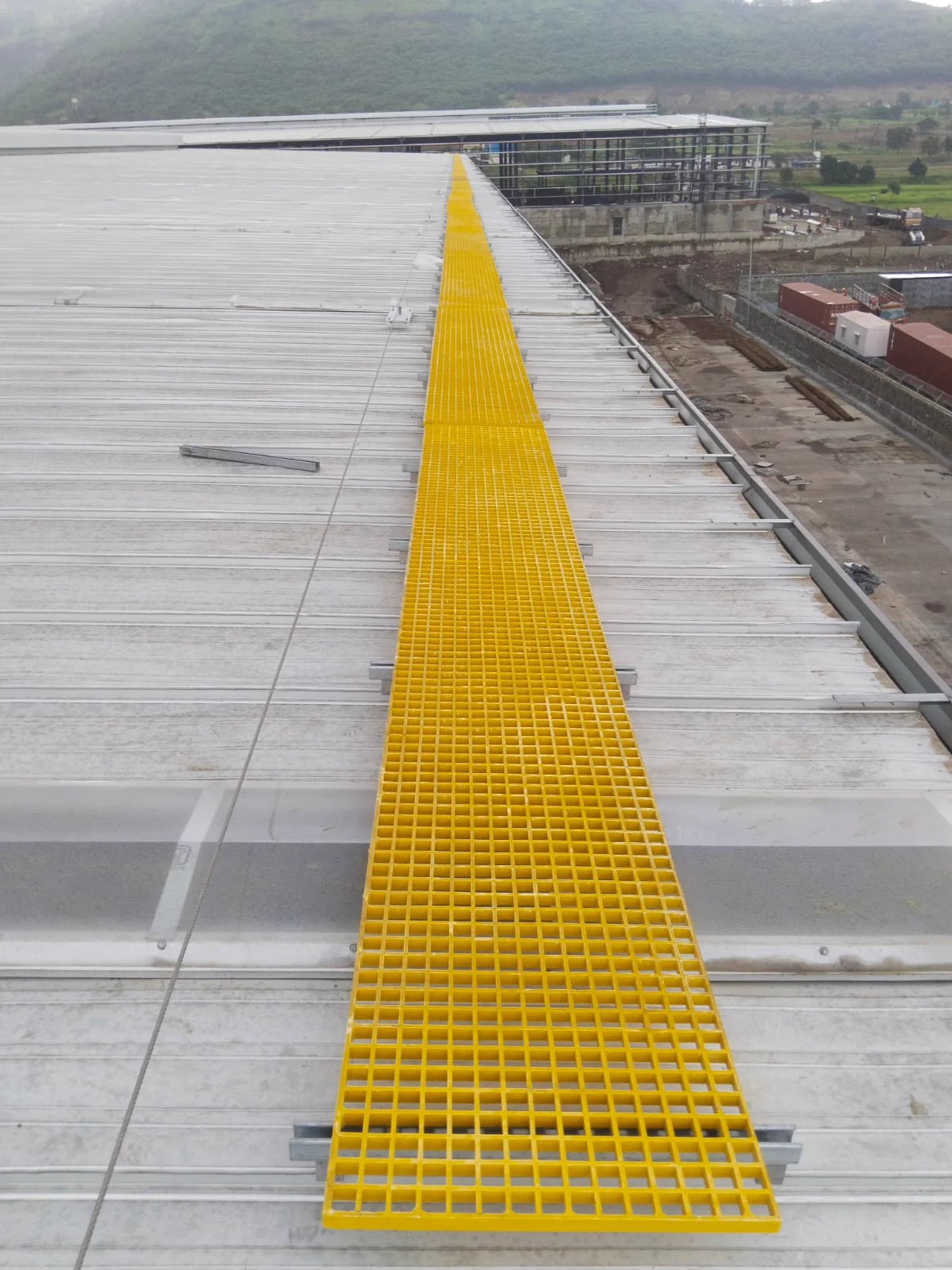 TsaF aluminium and FRP rooftop walkway installation on an industrial roof
